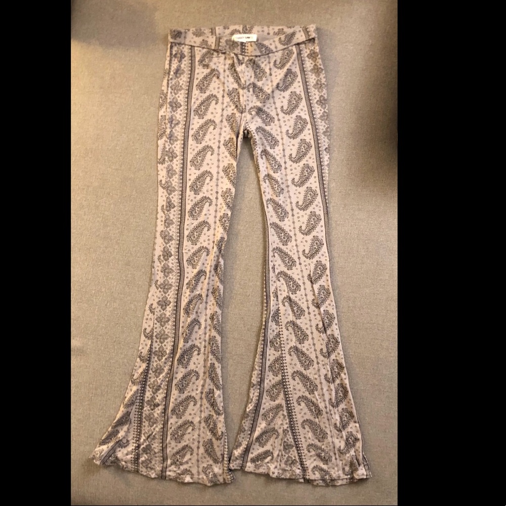 FLARED PANTS WITH BLACK PATTERN